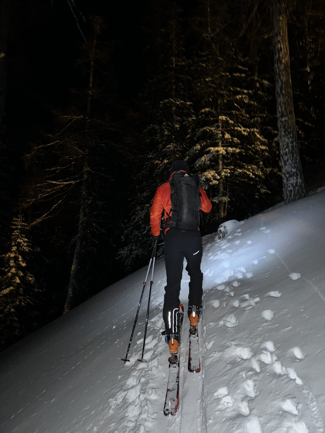Bran Hrivnak ski touring uphill at night